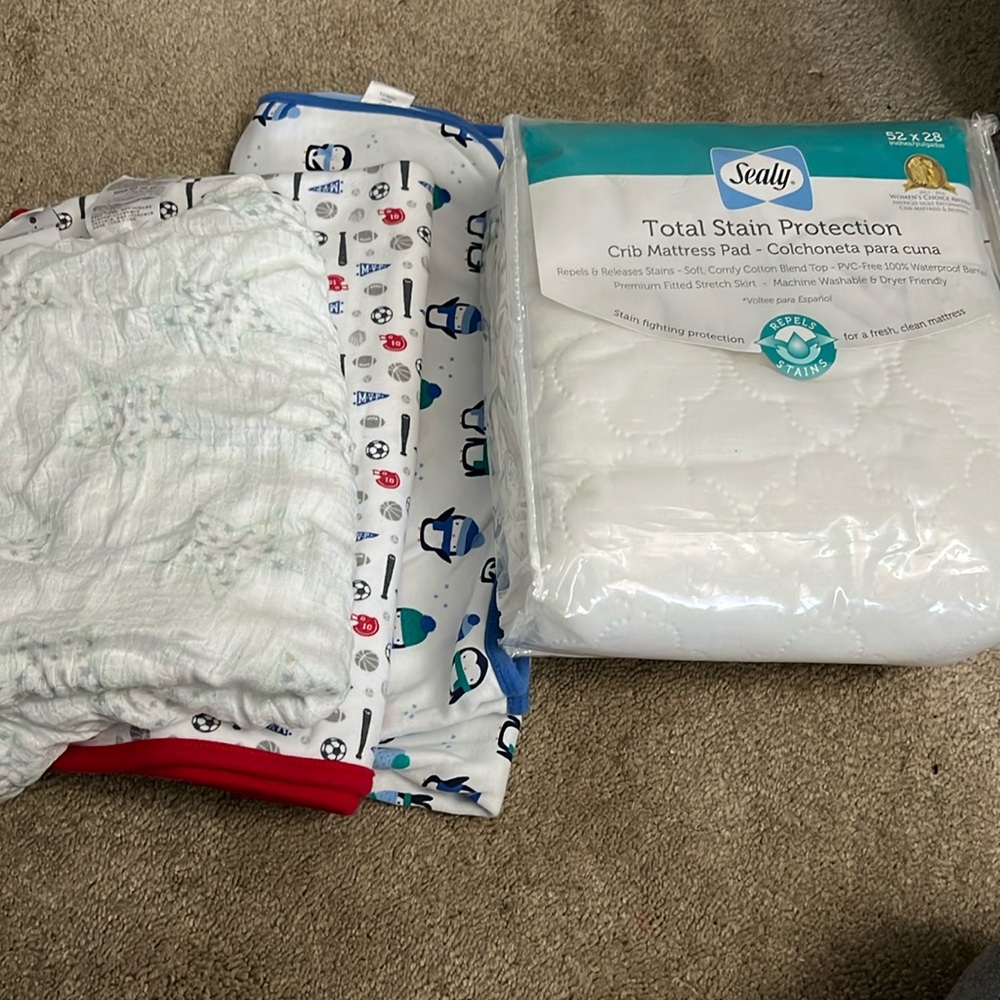 Crib mattress protector & 3 baby blankets